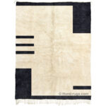 Black and cream area rug with geometric design